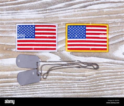 Small Usa Flag Patches And Military Identification Tags On Rustic White