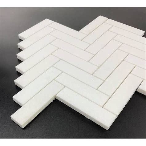 A White Tile Pattern That Looks Like It Has Been Cut In Half And Is