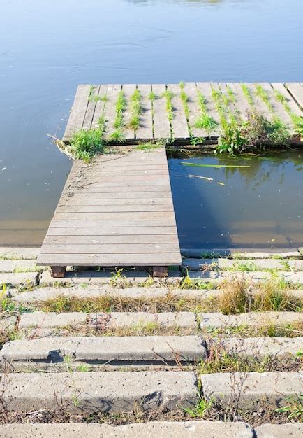 Free Photo Old Wooden Dock With Over Murky Water