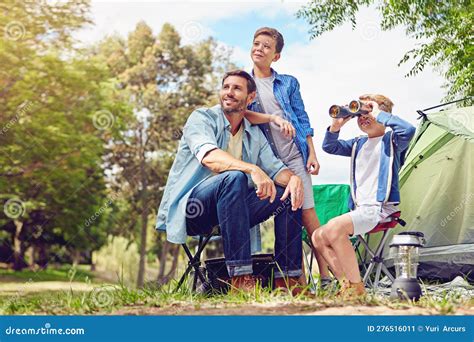 Theres Lots To See In The Forest A Father And His Two Sons Out Camping