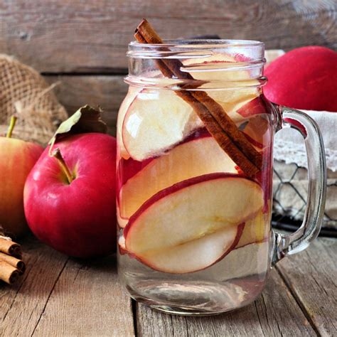 Autumn Themed Detox Water With Apple Cinnamon And Red Pear In A Mason