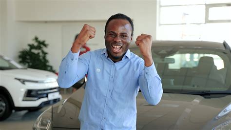 Young Happy African Man Getting The New Car Right Hand Drive Car