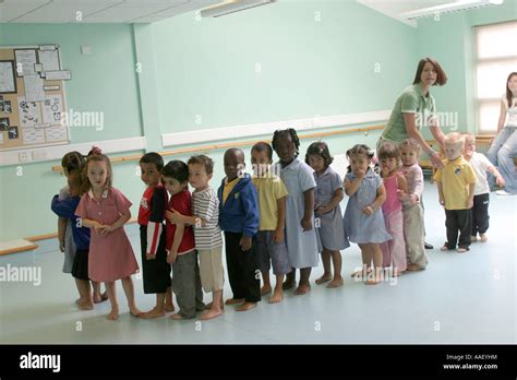 Preparatory class school children in line up with teacher in dance ...