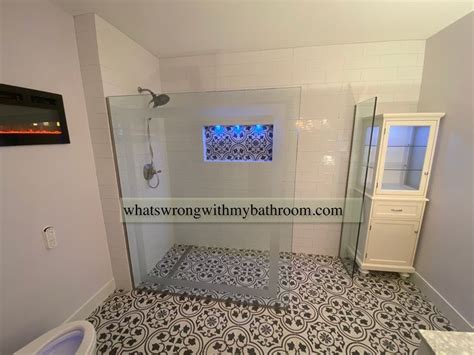 Curbless Walk In Shower With Subway Tiles And Lighted Niche Shower