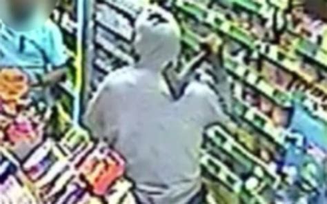 Cctv Terrifying Moment Axe Wielding Robber Attacked Shop Worker Before