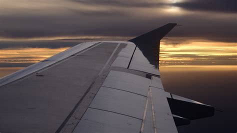 Fotos Gratis Mar Ala Nube Cielo Puesta De Sol Aeronave Veh Culo