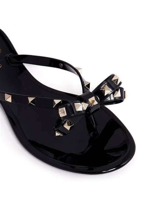 Lyst - Valentino Rockstud Bow Flat Jelly Sandals in Black