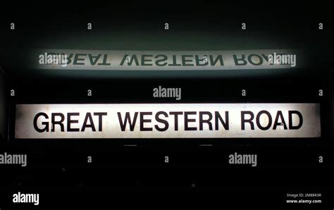 Great Western Road Bus Stop Sign Illuminated And Reflected Stock Photo