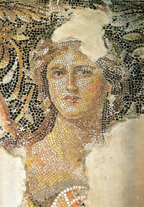 an image of a woman's face made out of mosaic tiles