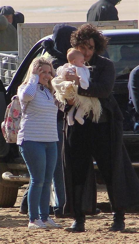 Pics of Poldark star Aidan Turner on set holding a baby sent the ...