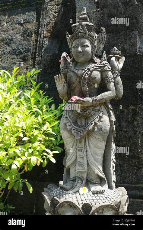 Statues of guardian gods temple in Bali. Brahma Vihara Arama with ...