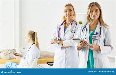 Attractive Female Doctor In Front Of Medical Group Selective Focus