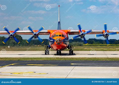 Cavok Air Antonov An 12 Cargo Plane At Airport Apron With Marshaller