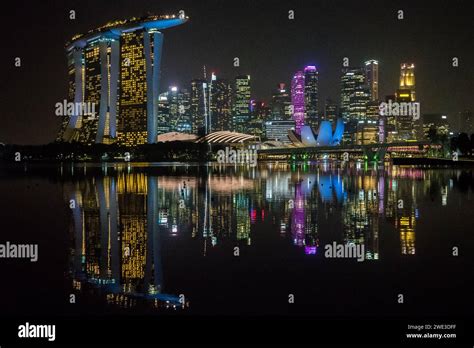 Singapore city skyline at night Stock Photo - Alamy