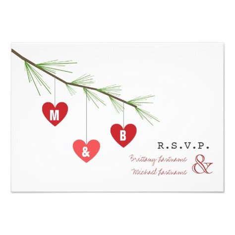 A Wedding Card With Red Hearts Hanging From A Tree Branch And Initials