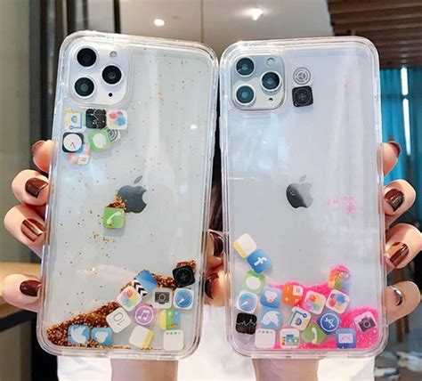 Two People Holding Up Their Iphone Cases With Different Designs On Them