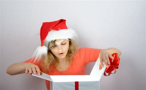 Girl In Santa Hat Opening A Box Stock Photo Image Of Warmth Merry