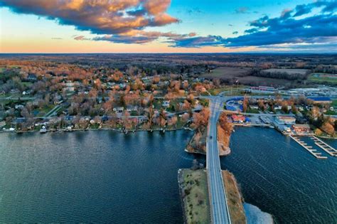 Premium Photo Causeway Over Lake To Small Town