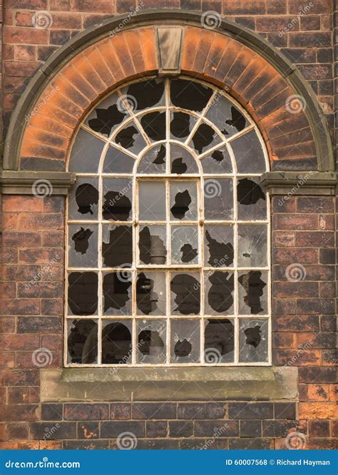 Round-headed Window with Broken Panes Stock Photo - Image of decay