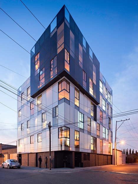 Black Glazing Wraps One Corner Of A Mexican Apartment Block