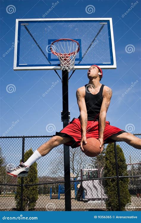 Man Dunking a Basketball stock image. Image of park, court - 9356365