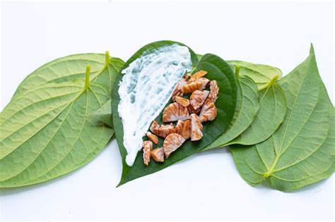 Premium Photo | Chewing betel nut, betel nut with cal lime powder on ...