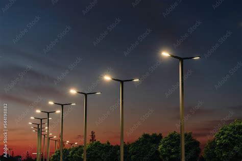 A modern street LED lighting pole. Urban electro-energy technologies. A ...