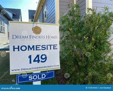 A New Home That Is Under Construction With A Sign In The Back Yard That