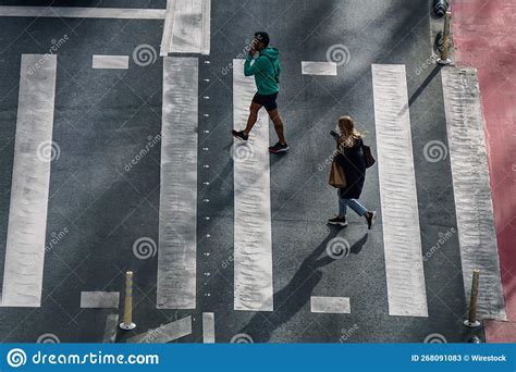 Pedestrians Crossing The Crosswalk In The City Editorial Stock Photo