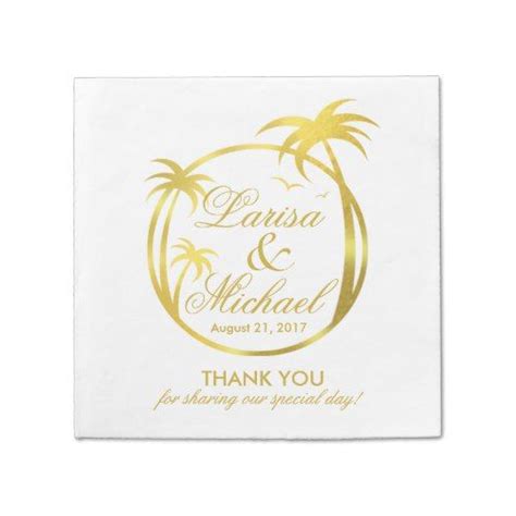 A White Napkin With Gold Foil On It And A Palm Tree In The Center That