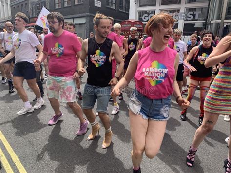 Gay Activists Dancing With Lgbt Flags At The Pride Parade In London