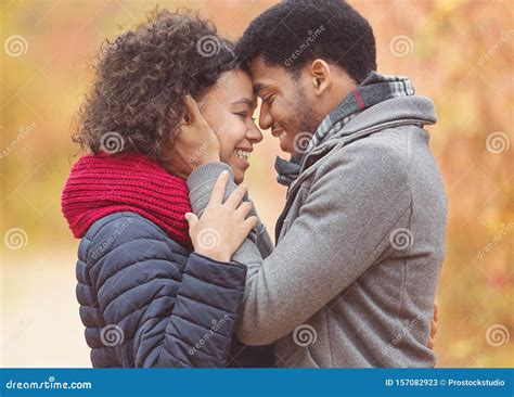 Tender Afro Couple Bonding To Each Other Touching Foreheads Stock