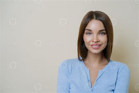 Photo Of Adorable Brunette Woman Has Natural Makeup And Healthy Perfect Skin Smiles Tenderly