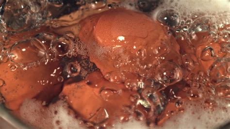 Super Slow Motion In Boiling Water With Air Bubbles Boiled Eggs Macro