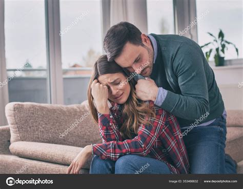 Man Consoling Sad Girl Home Hug His Presence Stock Photo by ©budabar ...