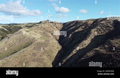 Flying towards a single wind turbine on a wind farm. Meridian Energy ...