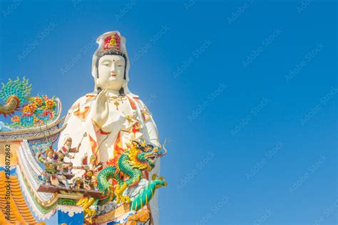 Giant White Guanyin Statue With Blue Sky Background Guanyin Or Guan