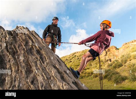 Rock climber abseiling holding climbing hi-res stock photography and ...