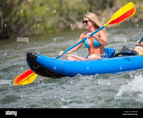 Floating The Boise River Woman In Bikini Having Fun Kayaking The River