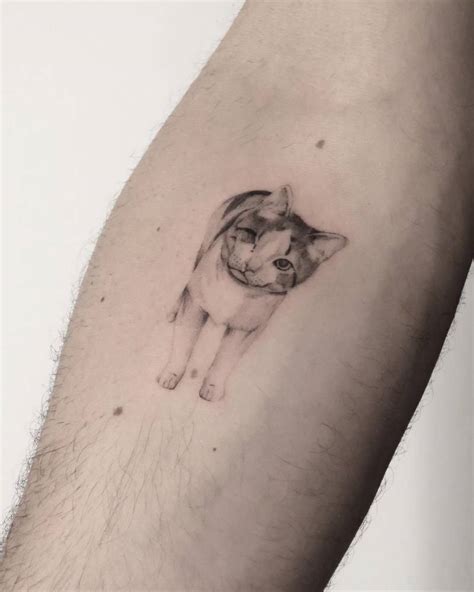 Micro Realistic Cat Tattoo On The Inner Forearm