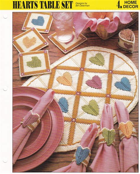 A Table Set With Hearts On It And Napkins Placemats And Plates