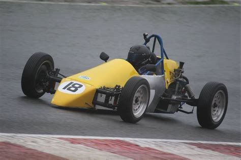 Yellow Race Car On Track