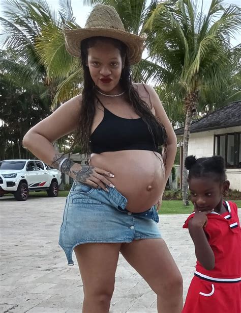 Rihanna shows off baby bump in miniskirt, crop top in Barbados