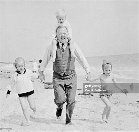 Mickey Rooney Goes For A Run Down The Beach Here With His Kids During