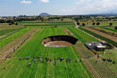 Sinkhole in Mexico Photos Shows House on Edge of Colossal Crater - Newsweek