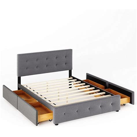 the bed frame is made up and has two drawers underneath it, with one ...