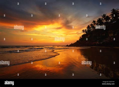 Sunset on Varkala beach, Kerala, India Stock Photo - Alamy