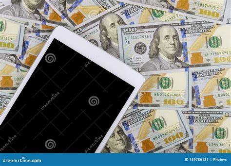 American Banknotes Hundred Dollar Bills On Digital Devices Tablet With