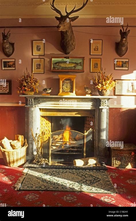 Detail Of Fireplace In A Beautifully Lit Victorian Hunting Lodge Hotel