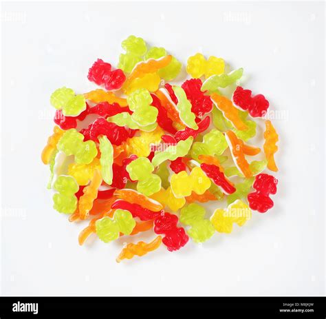 Pile Of Colorful Gummy Candies In The Shape Of Animals On White